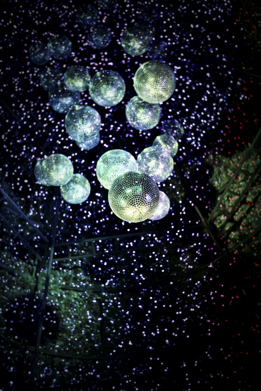 Mirror balls lighting a dark room